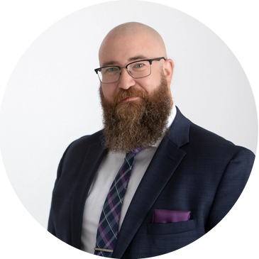 Mike Bissett, CFP®, Financial Advisor. A man in a suit with a beard and glasses.
